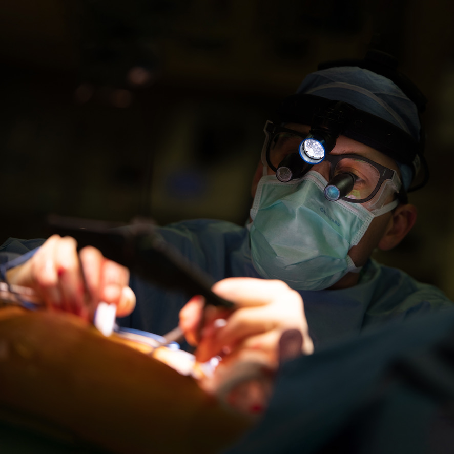 Dr. Leidenfrost operating under a surgical headlight