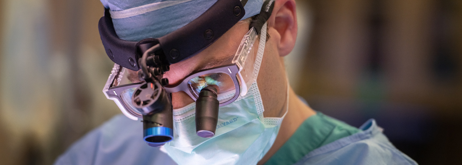 Close-up of Dr. Leidenfrost wearing surgical loupes
